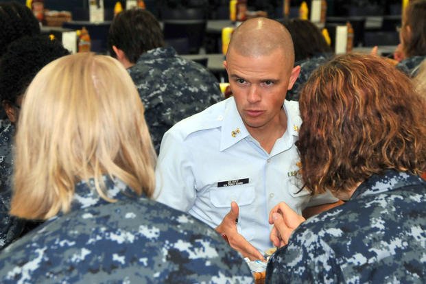 U.S. Coast Guard master chief speaks with recruits