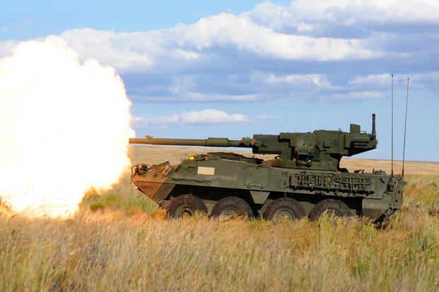 Stryker equipped with a mobile gun system fires a round of high explosive ammunition
