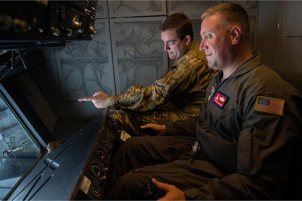 An in-flight refueler/instructor goes to work.