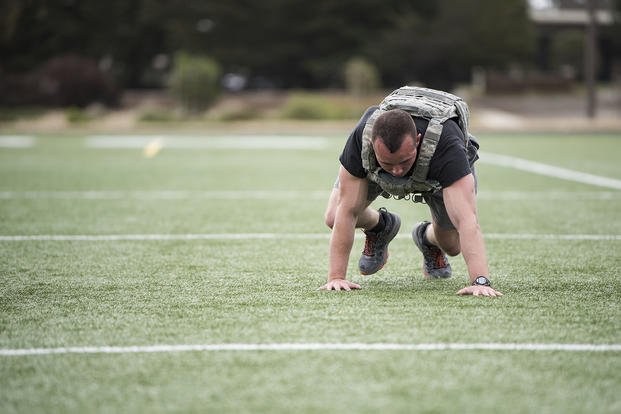 Security Forces Squadron defender performs bear crawl.