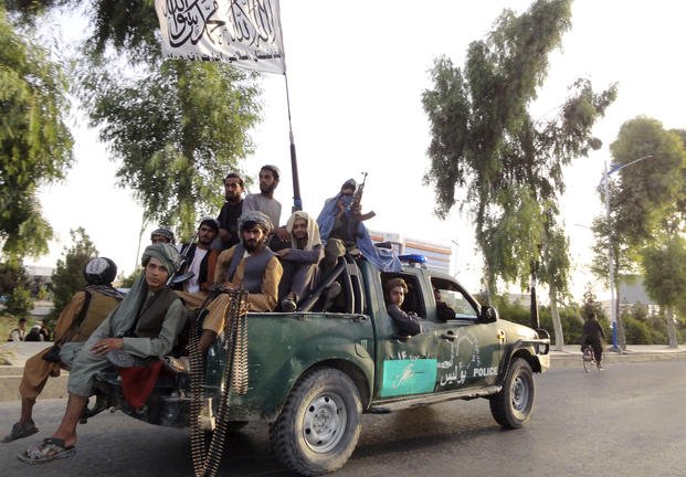 Taliban fighters patrol inside the city of Kandahar, southwest Afghanistan