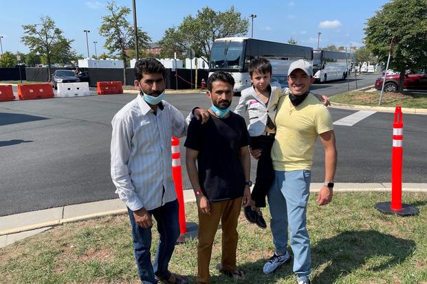 Maj. Joshua Rodriguez and Lt. Col. Mohammad Iqbal Nuristani outside of Dulles Airport. 