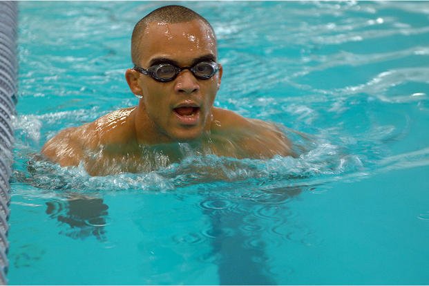 Senior airman swims during physical ability and stamina test.