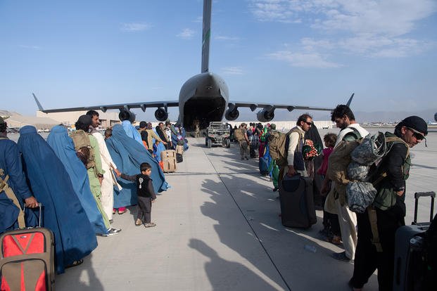US Air Force help evacuation Afghans after Taliban takes over Kabul.
