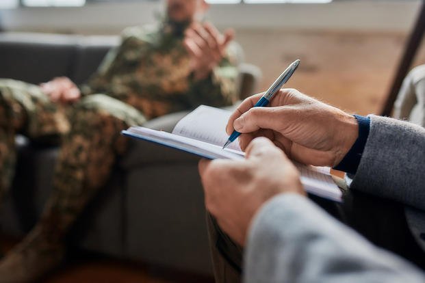 Adobe Military Soldier Conversation with Civilian Taking Notes