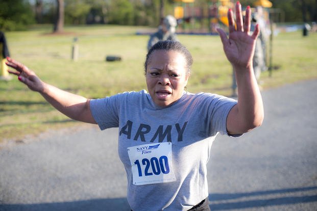 Army Reserve soldier finishes run during physical fitness test.