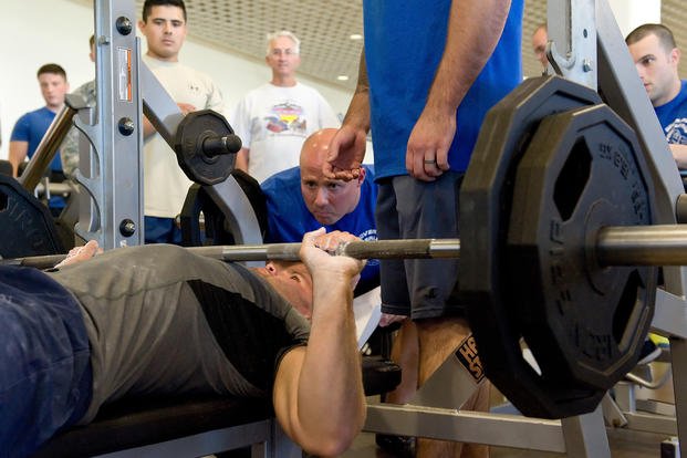 Airman takes part in powerlifting competition.