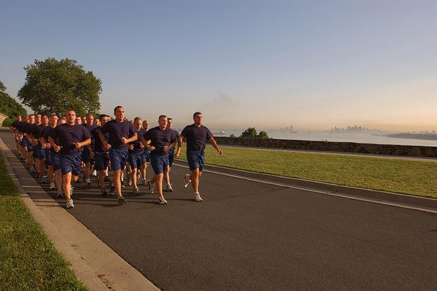 Coast Guard personnel take part in morning calisthenics.