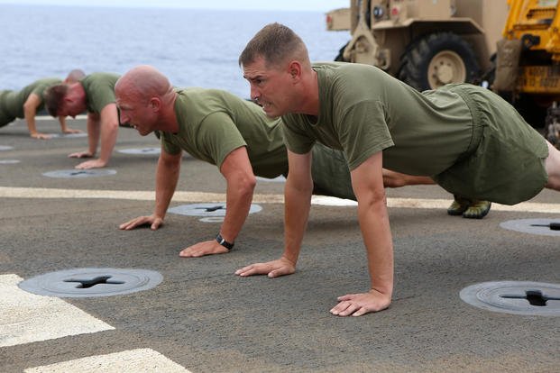 Marines conduct physical training.