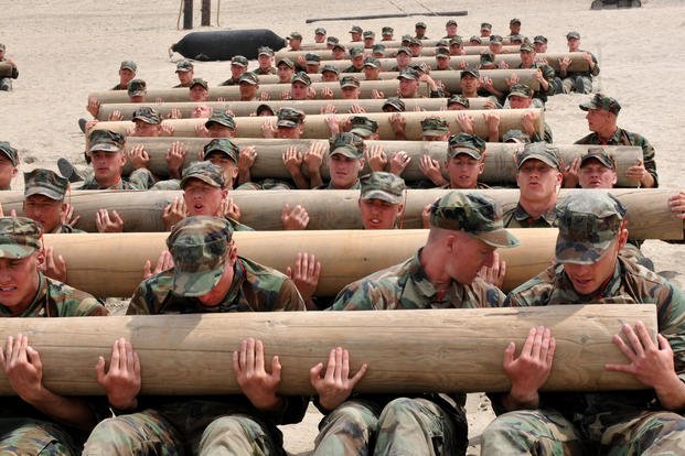 BUD/S candidates learn teamwork by carrying 600-pound log.