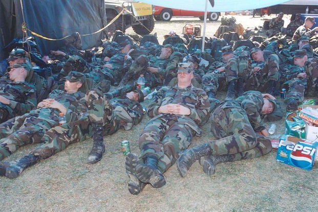U.S. Army personnel take a break from duty at the Pentagon, 12 September 2001. 