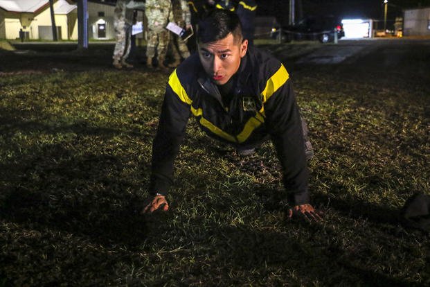 Guardsman does push-ups during Best Warrior Competition.