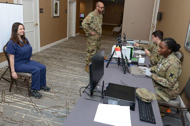 Military ID cards are created at a temporary facility in New Orleans.