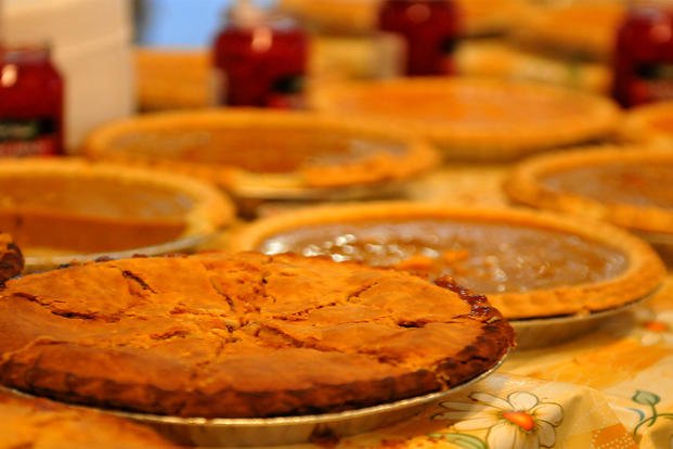 Paratroopers prepare to enjoy pie for dessert for Thanksgiving.