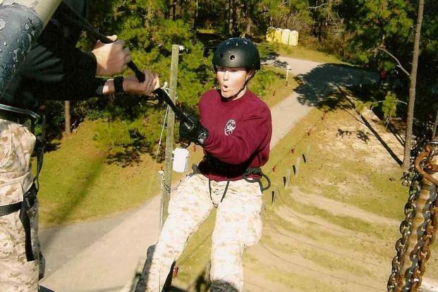 Kate Hendricks Thomas rappels from a tower while serving as a Marine