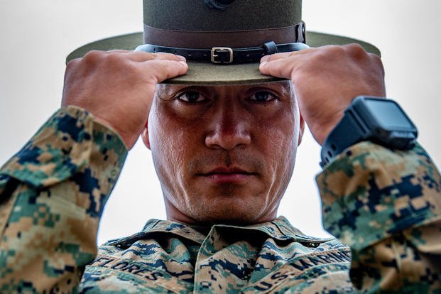 A Marine drill instructor adjusts his campaign cover.