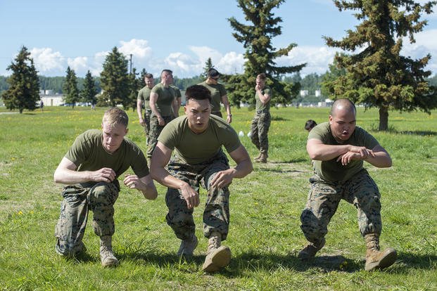 Marines do lunges as part of physical training.