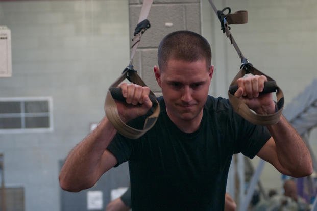 A Copperas Cove Special Weapons and Tactics team member trains on TRX. 