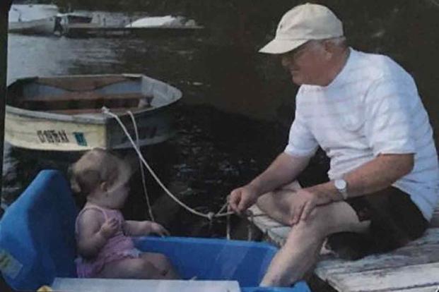 Lindsay Bennett with her grandfather on a boat