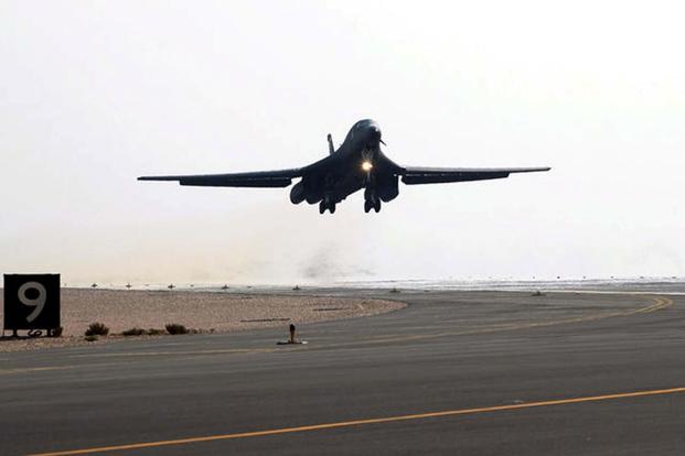 An Air Force B-1B Lancer aircraft takes off from the runway of an air base in southwest Asia.