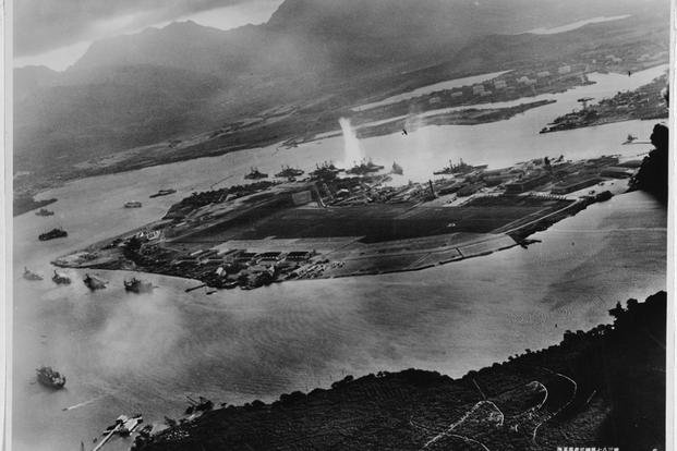 Photograph taken from a Japanese plane during the torpedo attack on ships moored at Pearl Harbor on both sides of Ford Island.