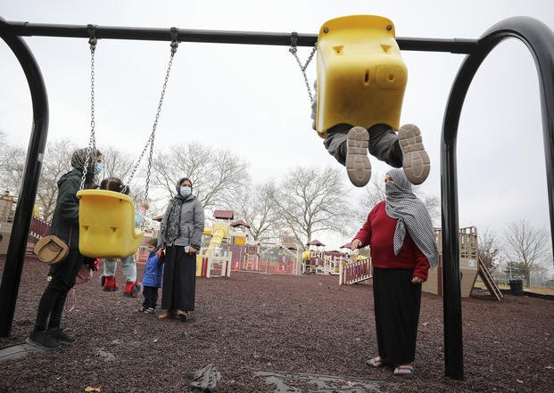 Afghan refugee mothers and children play in a park in Liberty Village on Joint Base McGuire-Dix- Lakehurst