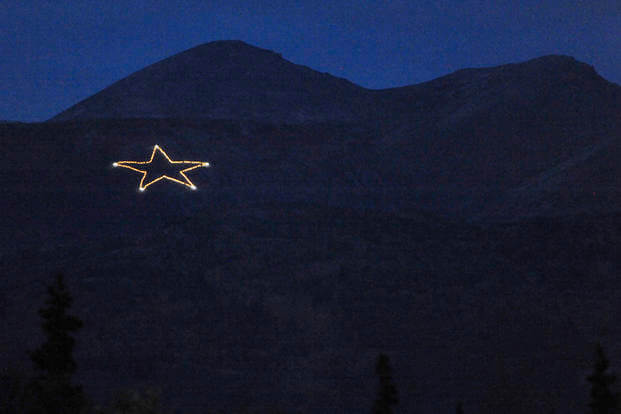 Joint Base Elmendorf-Richardson star is Illuminated on the side of Mount Gordon Lyon