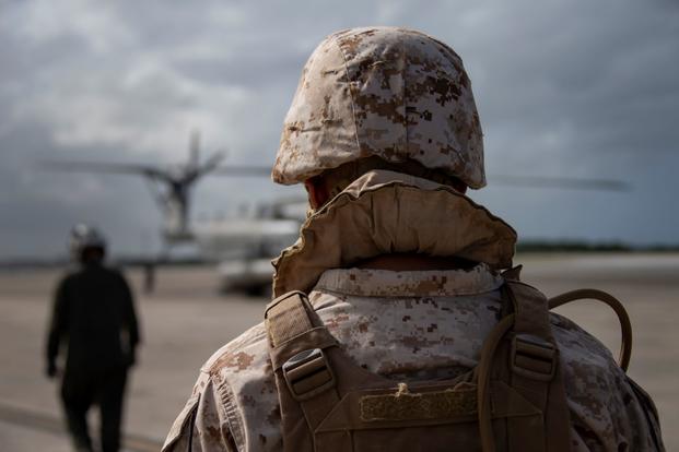 A Marine prepares to board a CH-53E Super Stallion at MCAS Futenma, Okinawa, Japan.