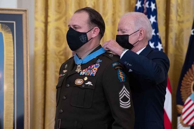 President Joe Biden presents the Medal of Honor to U.S. Army Master Sgt. Earl D. Plumlee during a ceremony at the White House in Washington, D.C. 