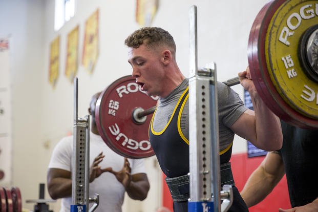 Marines compete in a powerlifting competition.