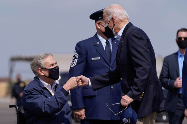President Joe Biden greets Texas Gov. Greg Abbott 