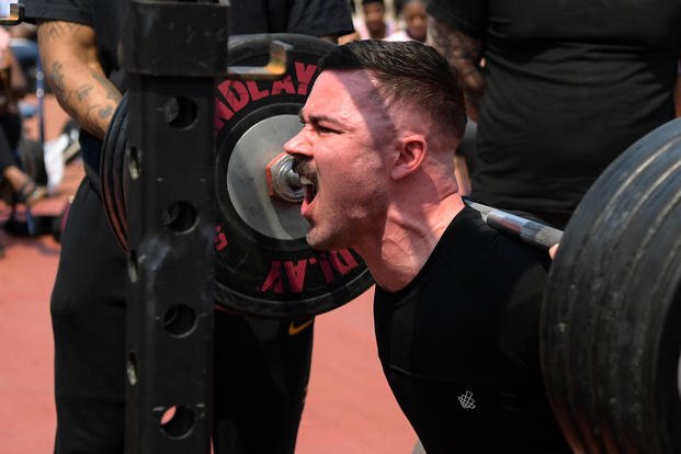 A senior airman performs a squat during a powerlifting competition at Osan Air Base.