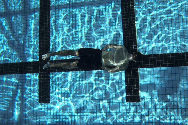 A Naval ROTC midshipman participates in a swimming exercise.