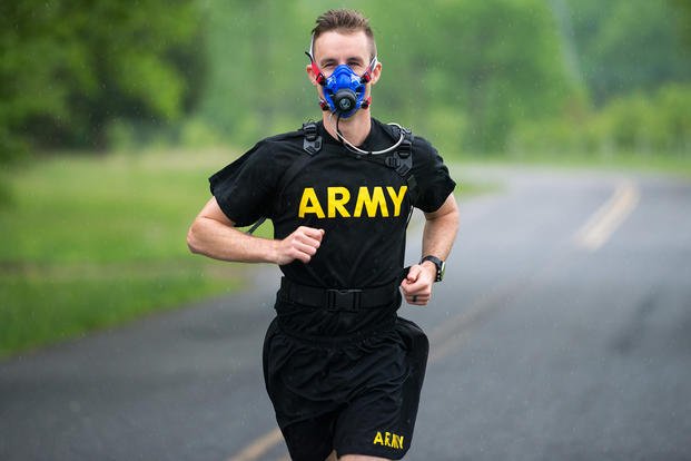 An Army soldier runs with the new K5 portable VO2 unit.