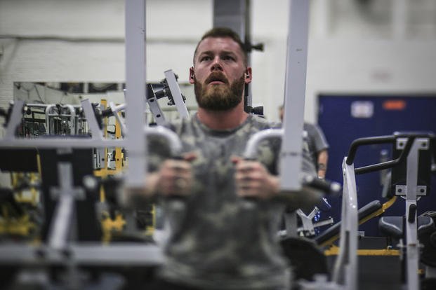 A combat-wounded Marine works out in the base gym on Joint Base McGuire-Dix-Lakehurst.