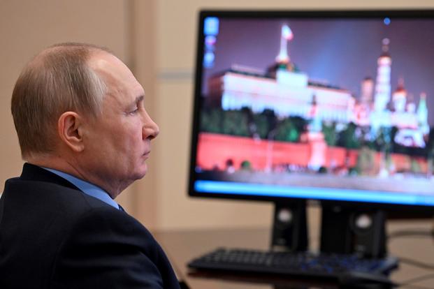 Russian President Vladimir Putin attends a virtual meeting. 