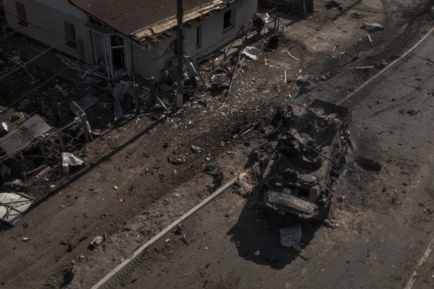 A destroyed Russian tank is seen on a road near Brovary, north of Kyiv.