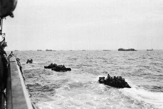 Landing craft loaded with assault troops head for the shore of the French coast early on D-Day.