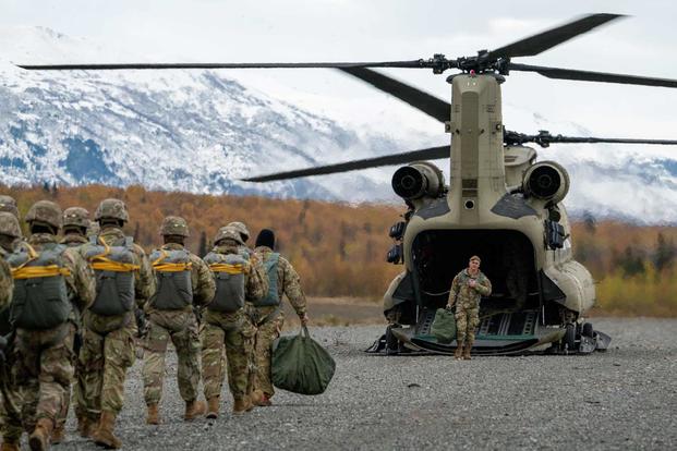 U.S. Army prepare to board a CH-47 Chinook.