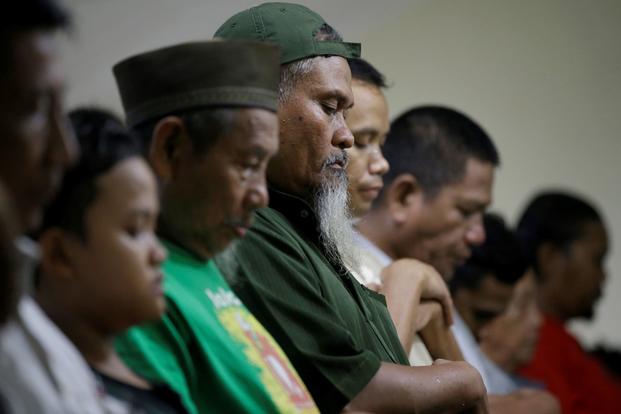 Former leader of Al Qaeda-linked Jamaah Islamiah Imron Baihaqi prays at a mosque in Jakarta, Indonesia.
