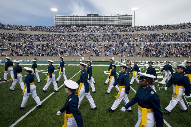 Air Force Academy cadets walk across the field at the Class of 2021 graduation ceremony.