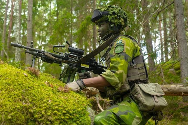 A Swedish Marine posts security during Exercise Archipelago Endeavor 19 in Sweden.