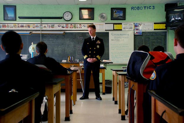 commanding officer of Navy Recruiting District Philadelphia, speaks with Navy Junior ROTC students