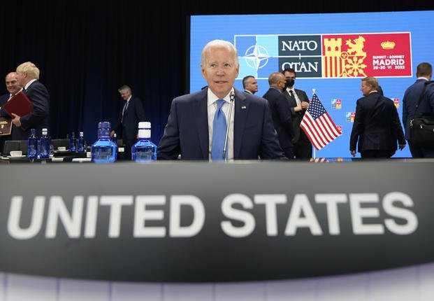 U.S. President Joe Biden waits for the start of a round table meeting at a NATO summit in Madrid