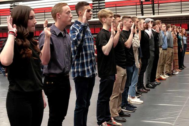 High school military recruits receive their oath of enlistment.