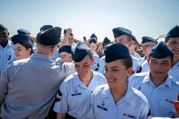 Space Force Guardians celebrate with their peers during graduation.