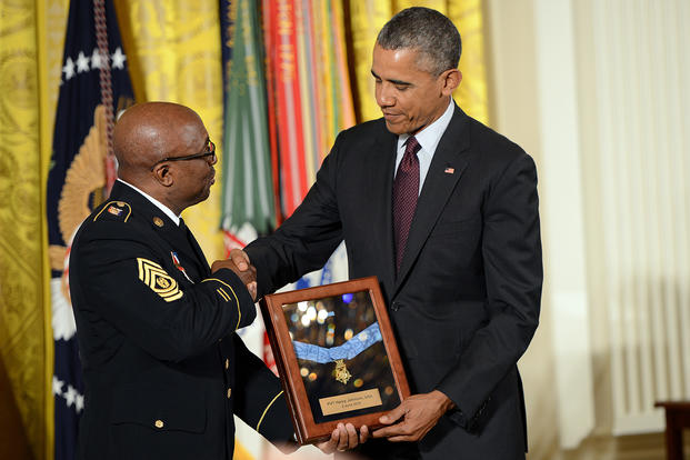 Command Sgt. Maj. Louis Wilson of the New York Army National Guard accepts the Medal of Honor on behalf of World War I Pvt. Henry Johnson.