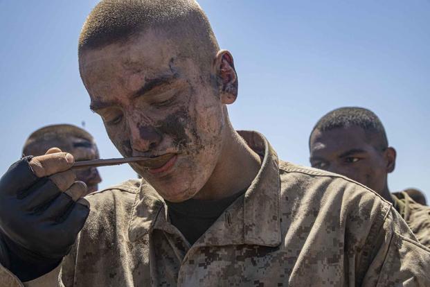 U.S. Marine Corps recruit “enjoys” MRE at Camp Pendleton.