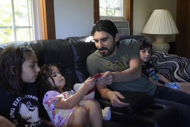 Afghan refugee with his family in Epping, N.H. 