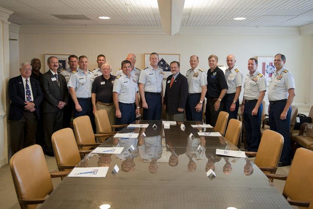  Vice Adm. Robert C. Parker, commander Coast Guard Atlantic Area, and the commanding officers of eight local commands sign an Employer Support of the Guard and Reserve statement of support.
